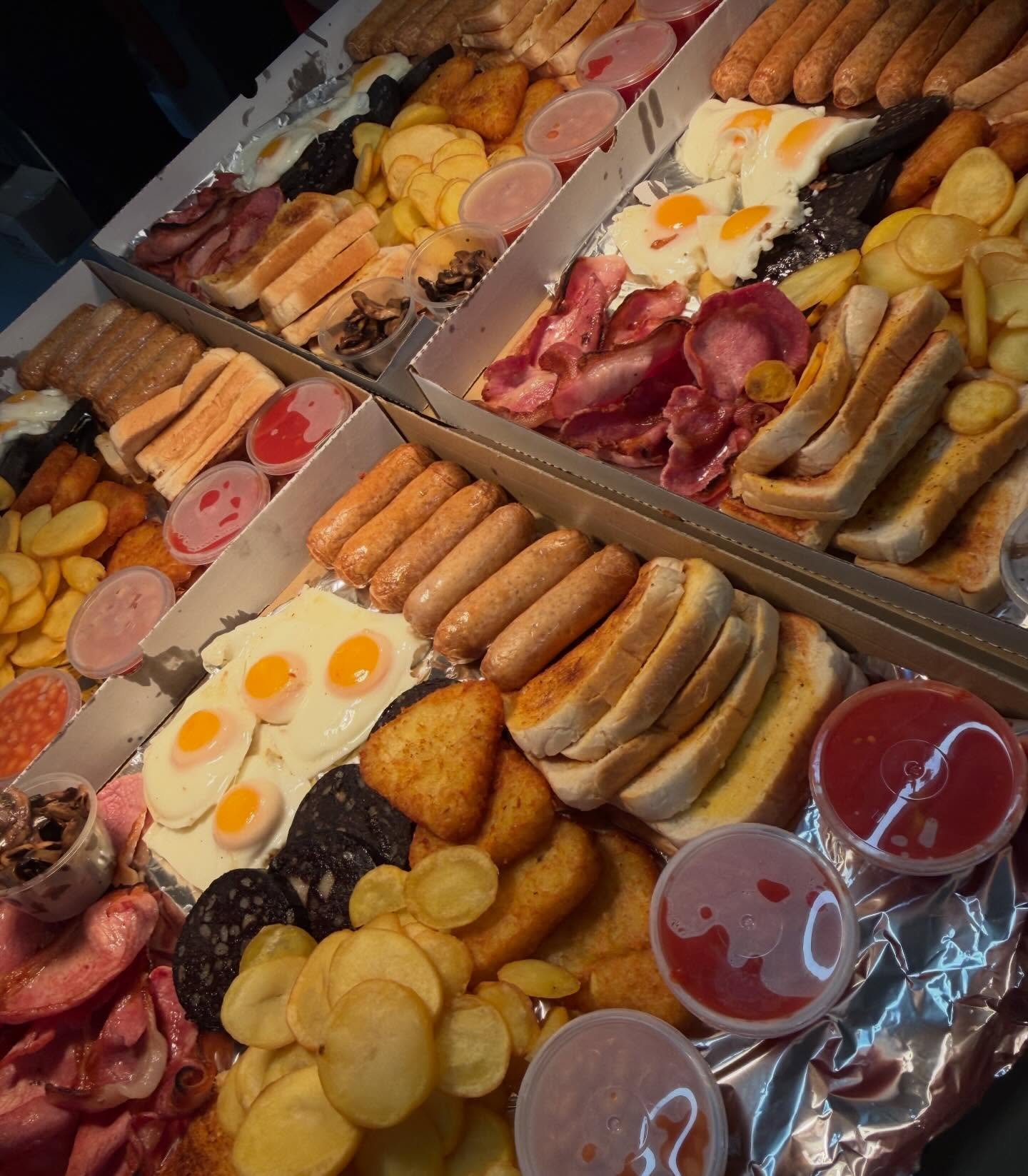 Large takeaway breakfast platters filled with sausages, eggs, bacon and toast at The Oven Door Cafe, Haydock